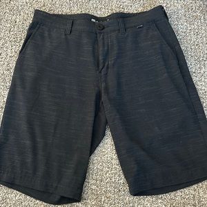 Travis Mathew black with slight gray line patterned shorts. Size 32